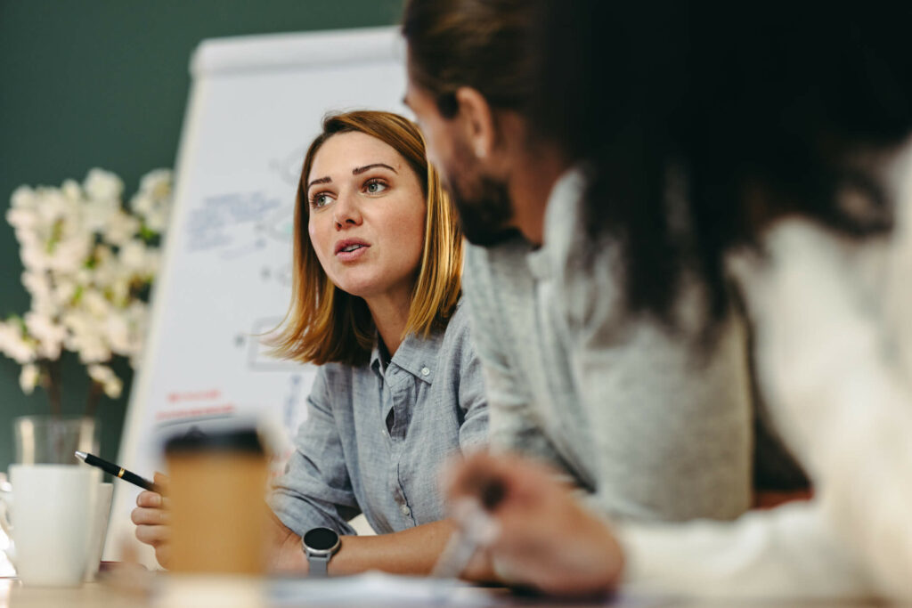 Woman in meeting speaking.