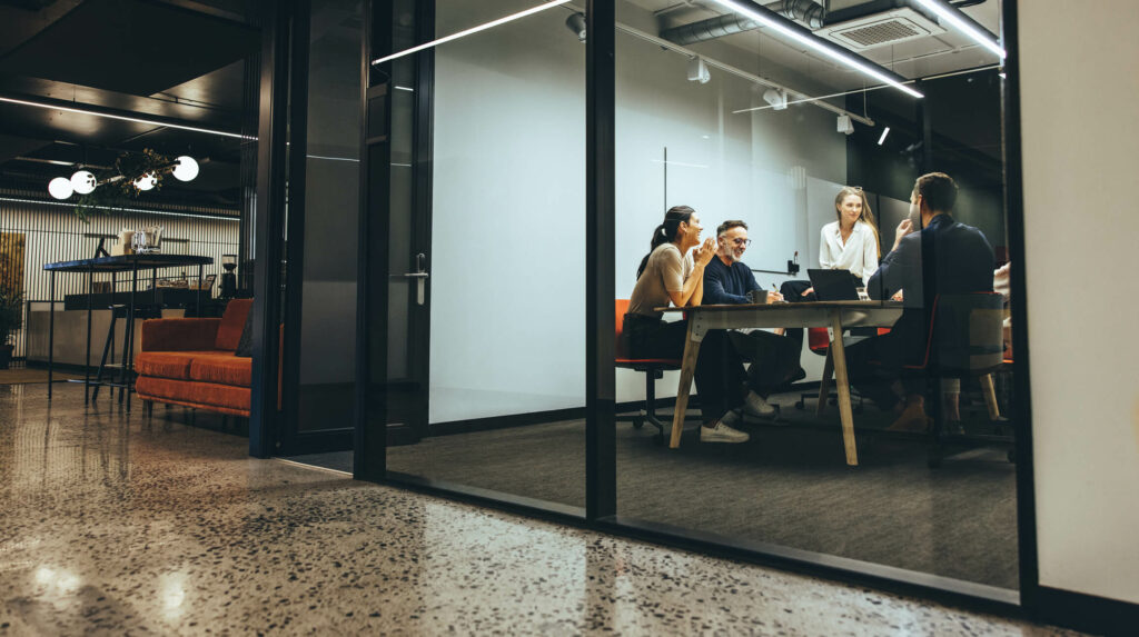 Office people having a meeting, smiling.