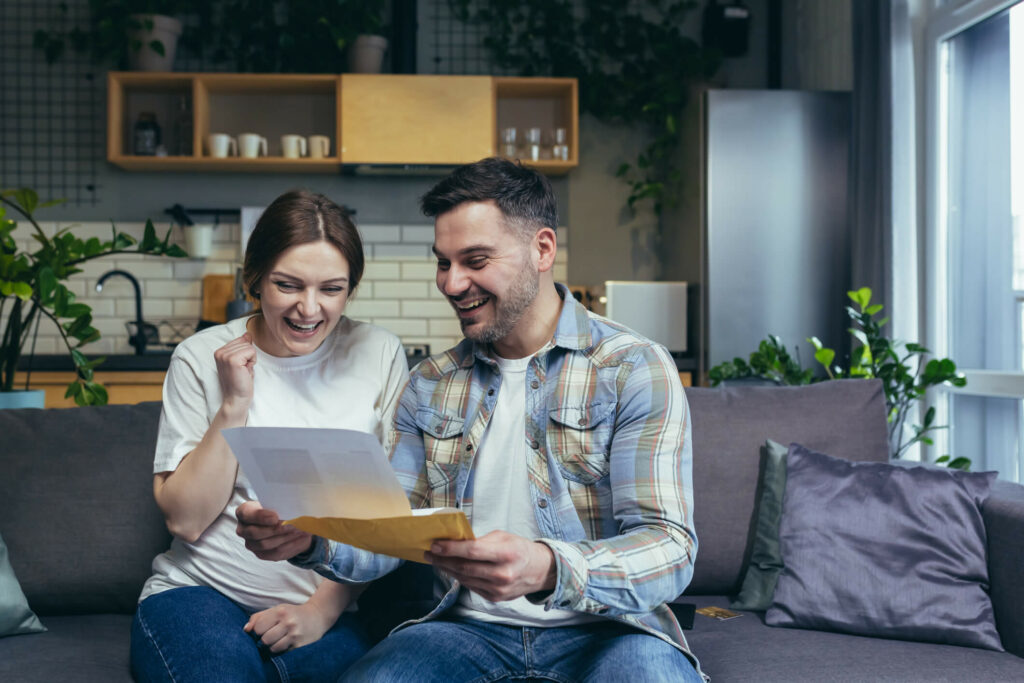 Happy couple looking at documents.