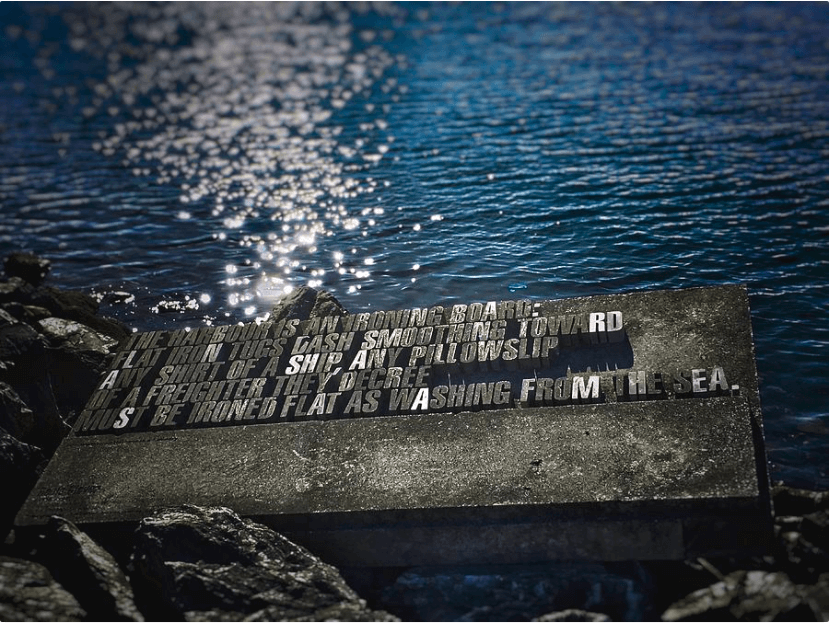 Rocks with concrete words near ocean