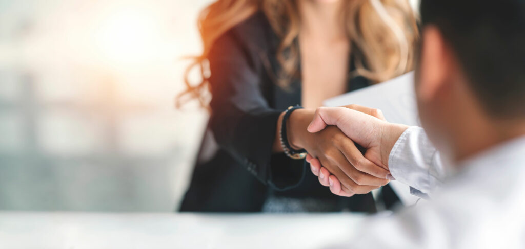 Business woman shaking hands